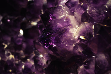 a close up of a bunch of purple crystals